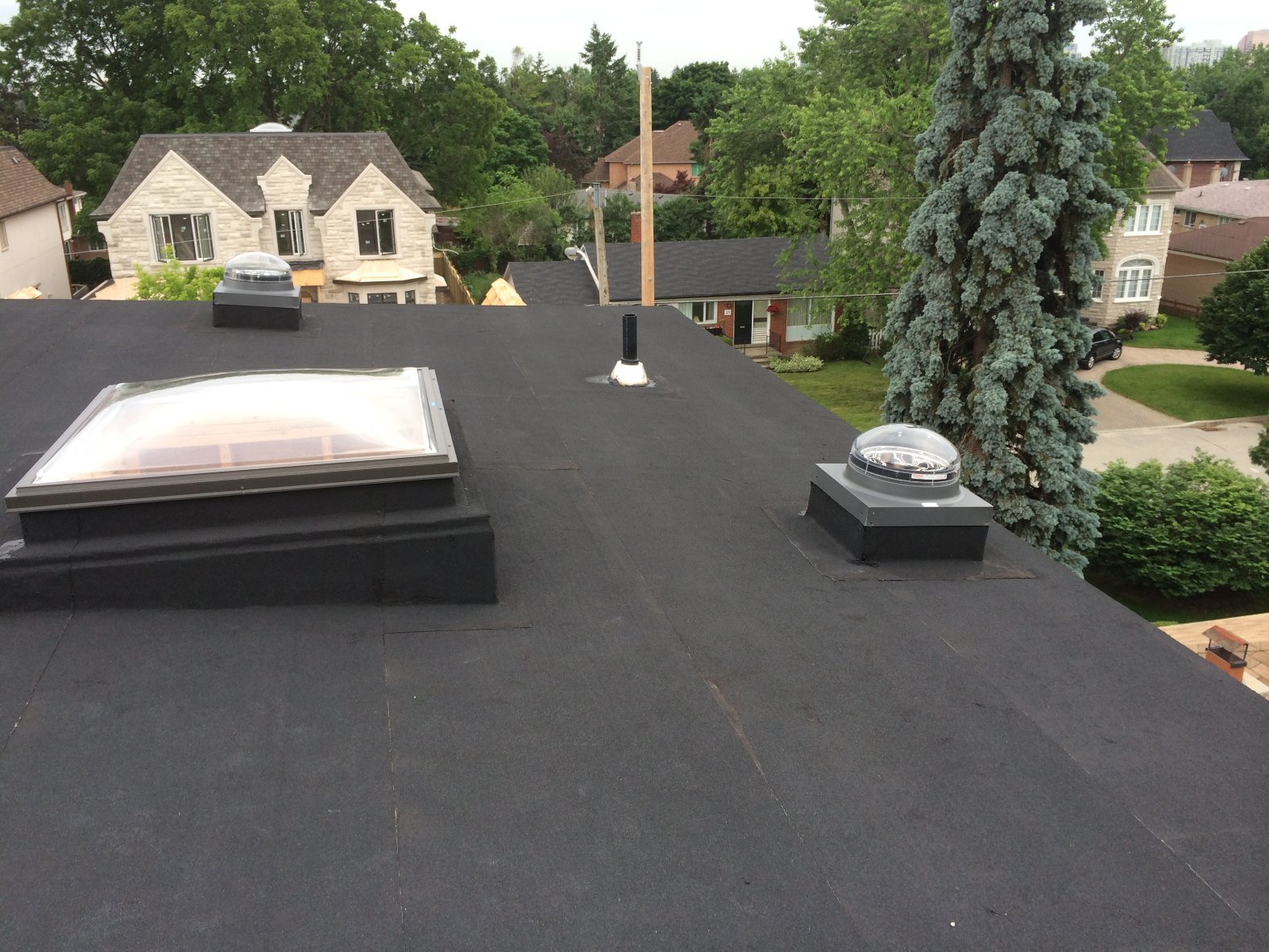 VELUX skylight and sun-tunnel dome on a flat roof